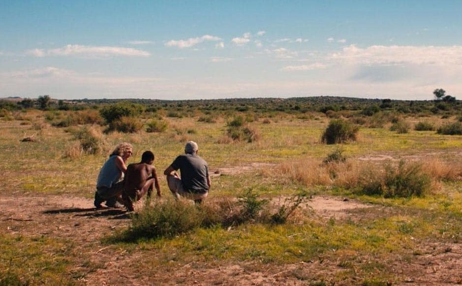 three people searching for Cheetah traces
