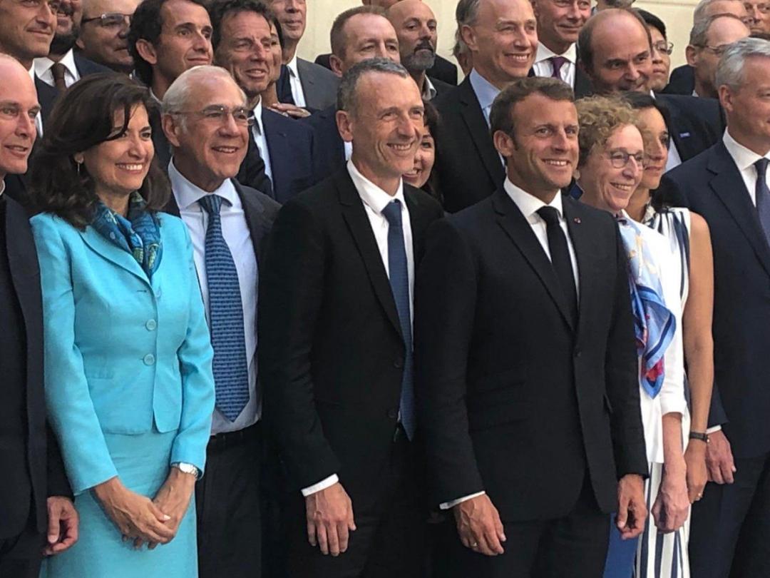 Group photo of politicians including Emmanuel Macron, taken at the launch of the Business for Inclusive Growth Coalition