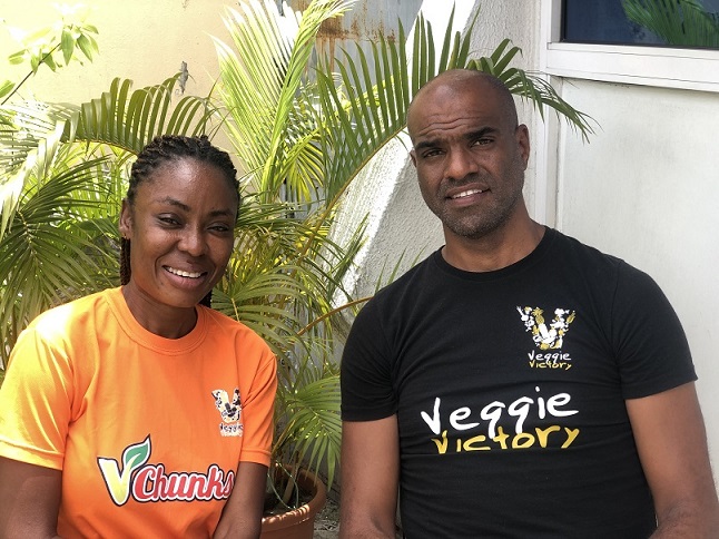 co-founders of VeggieVictory: an African woman standing next to an African man