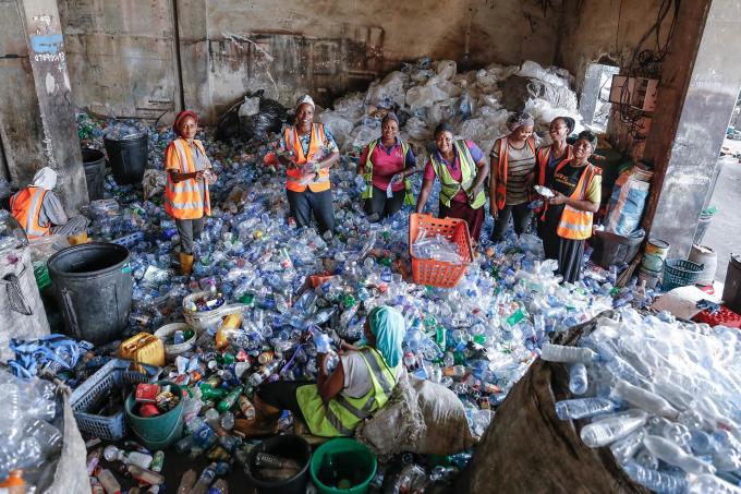 Workers at a recycling facility
