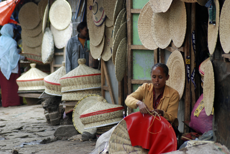 African woman manufacturing hats