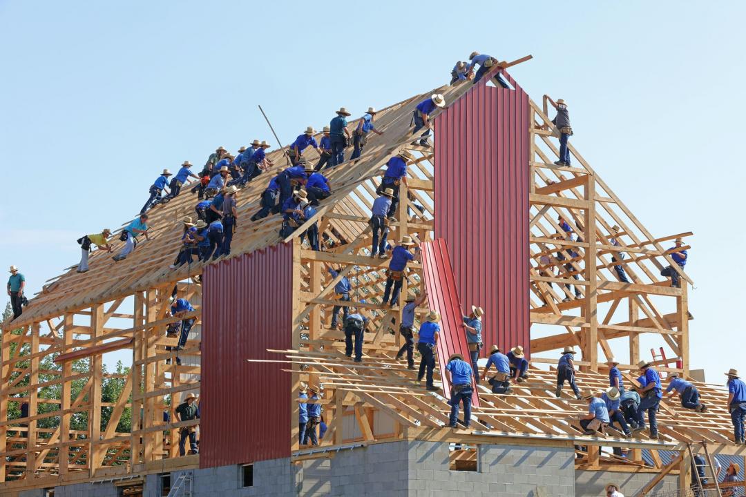 many people building a house