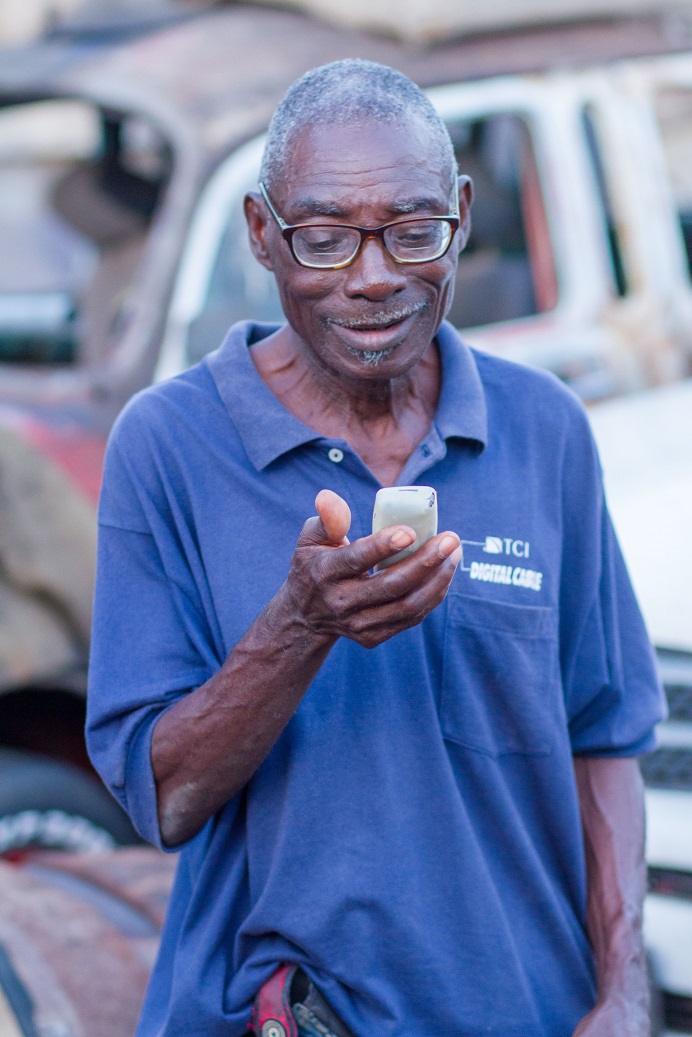 African man checking his phone