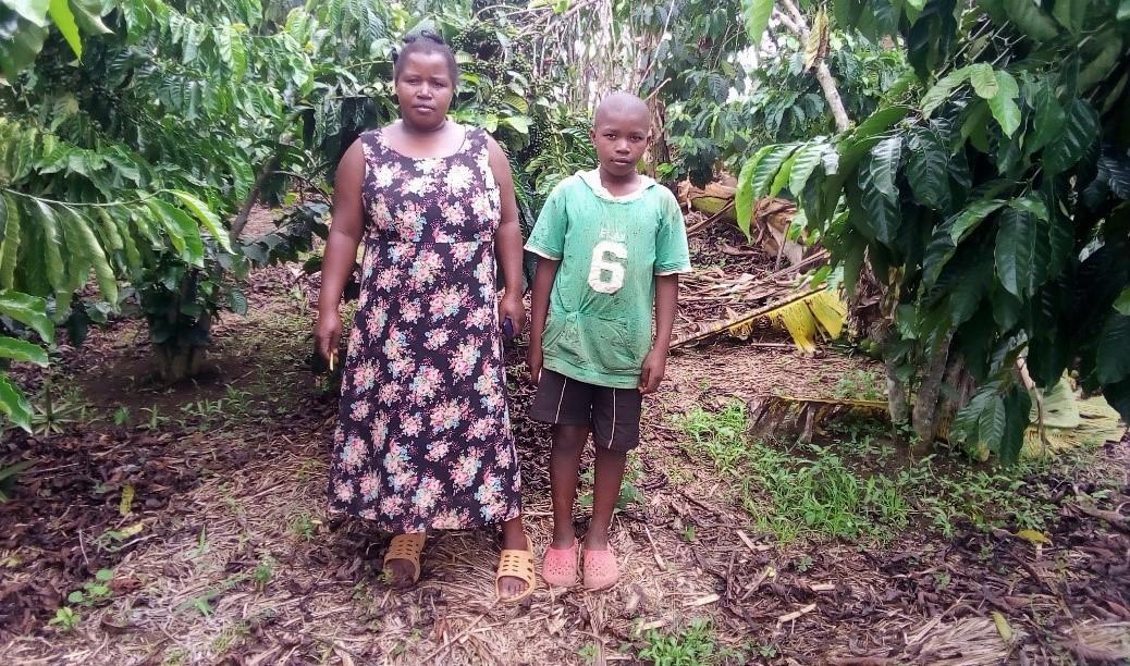 Farmer Ovia Biringwa with her son on the farm
