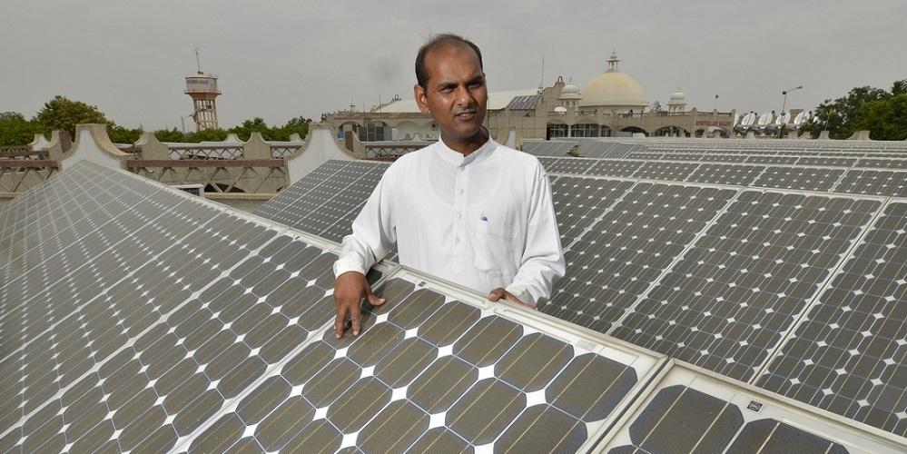 Indian man and solar panels
