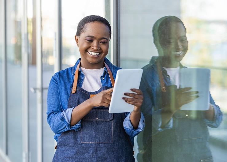 female black entrepreneur holding tablet