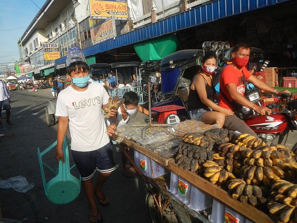 market visitors wearing masks
