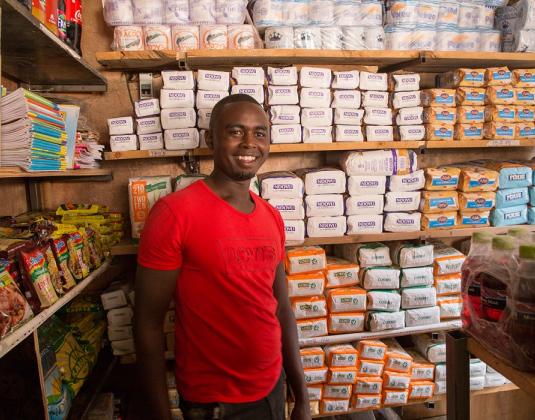 African shopowner standing in his store