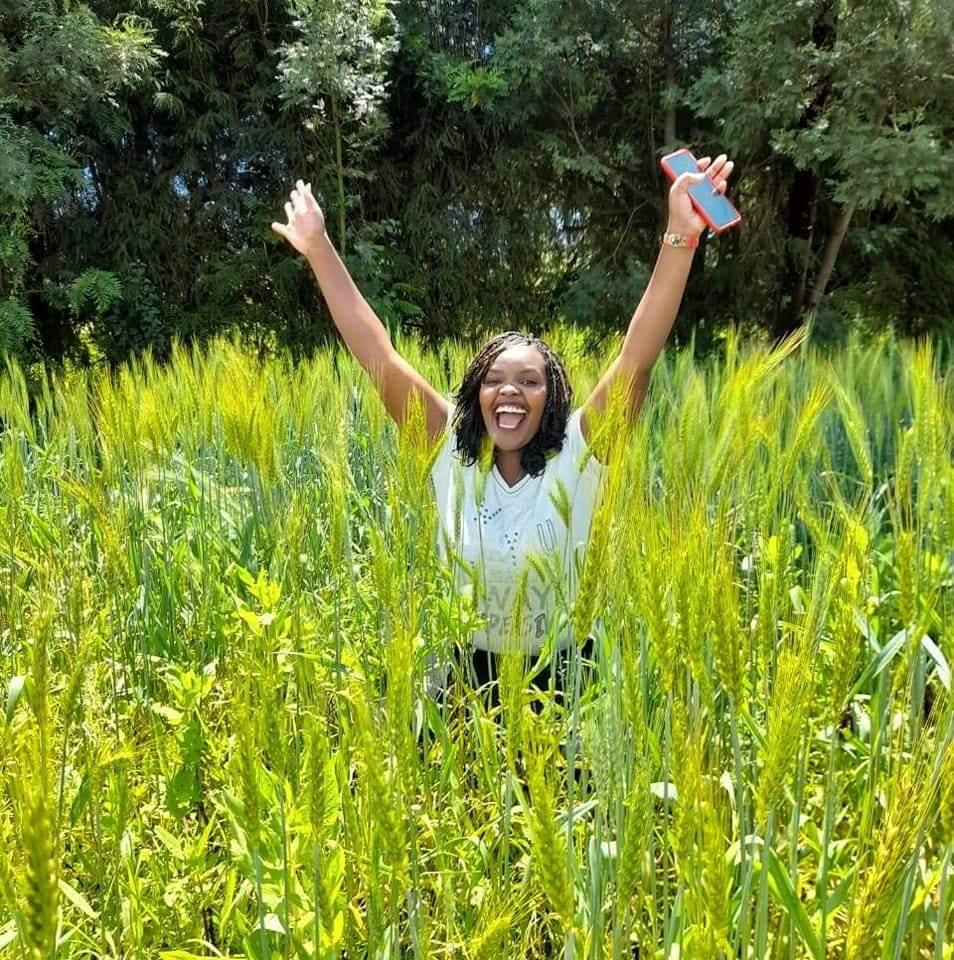 happy African woman in field